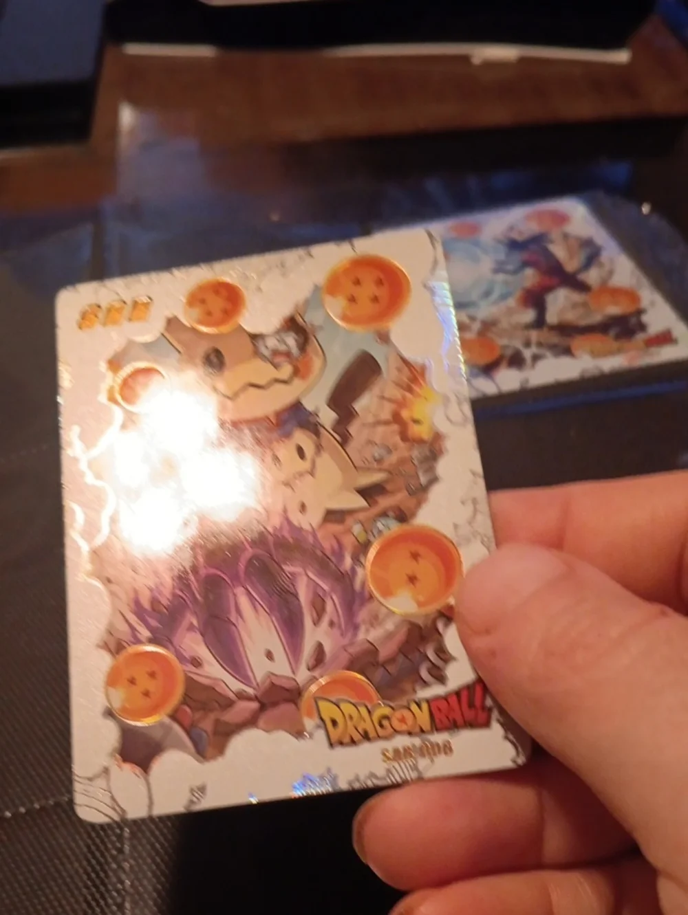 Pokemon Silver Holographic Card with Orange Dragon Orbs and Purple Energy